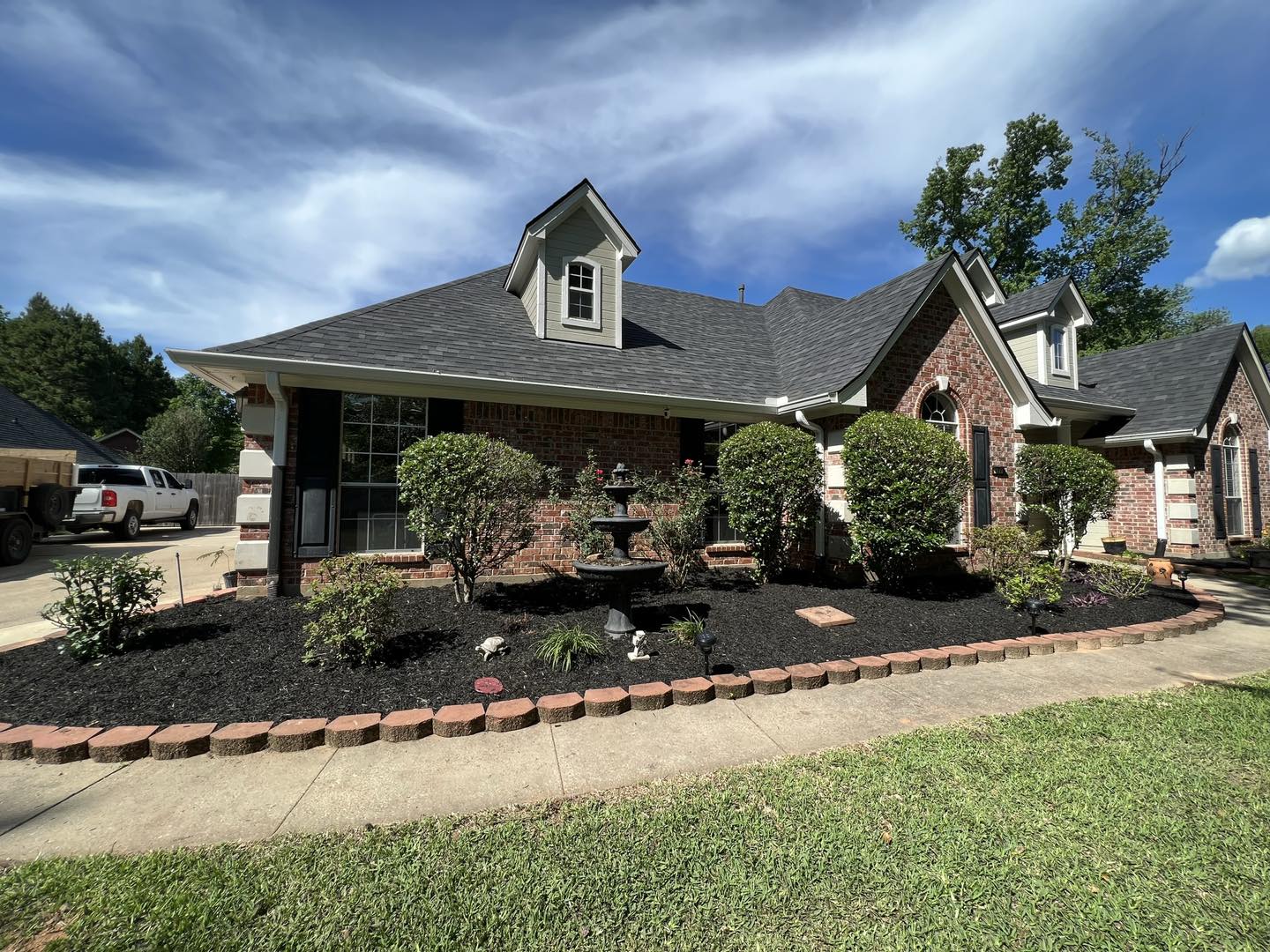 huge garden bed in front of house
