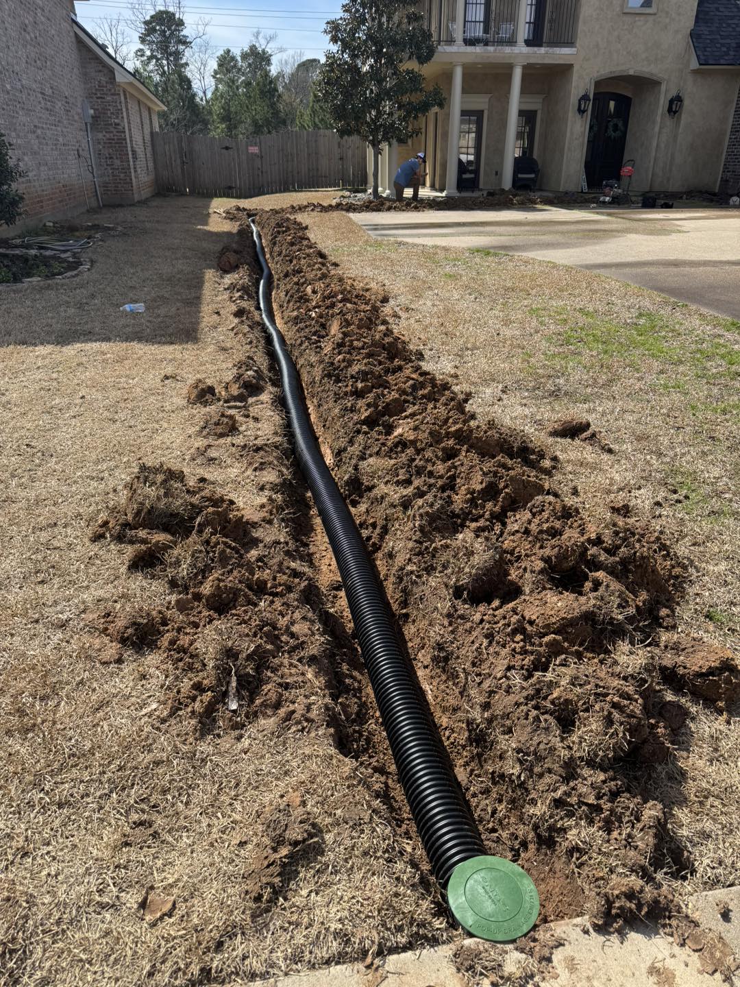 image of french drain with clean out being installed