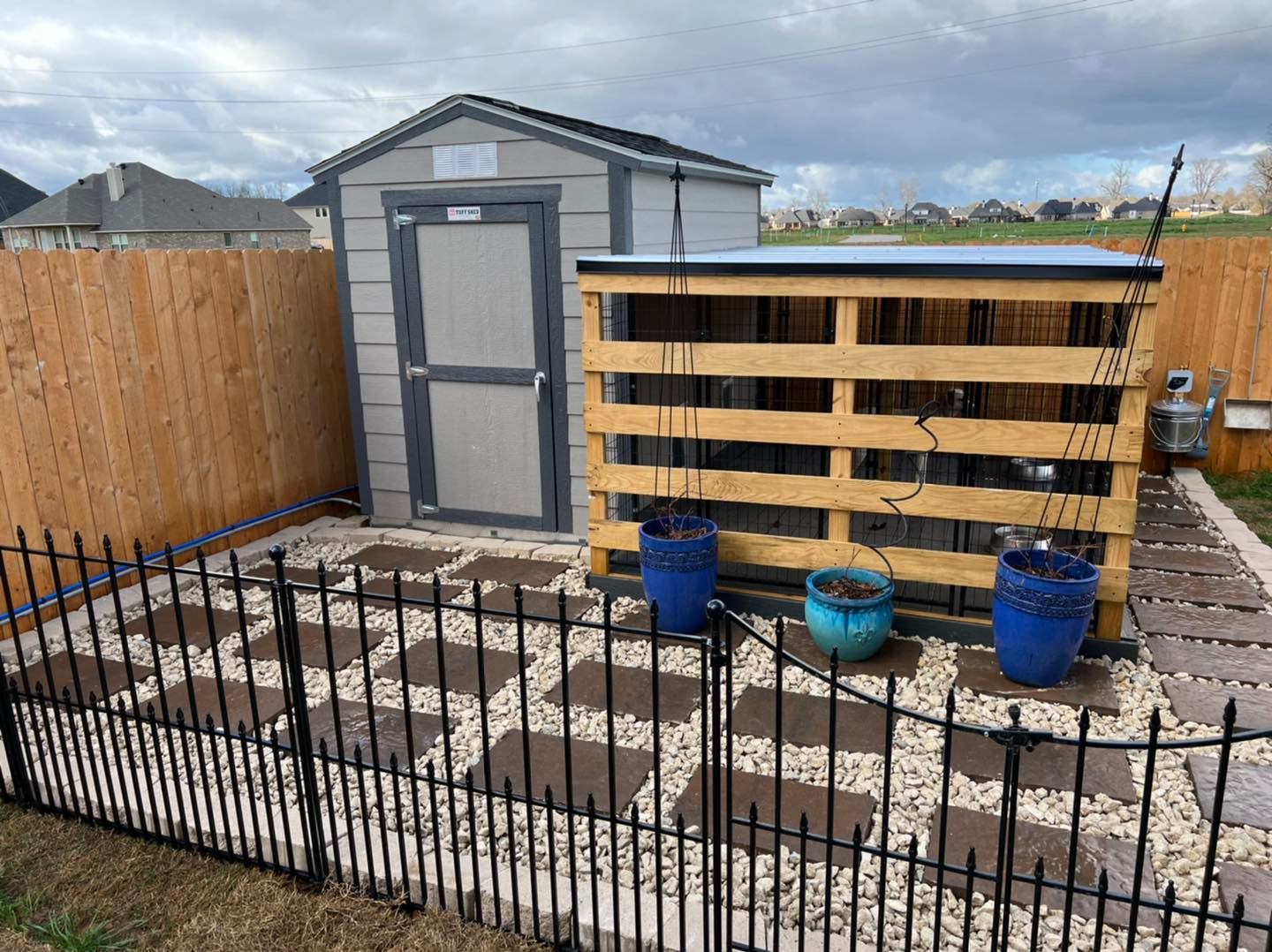 raised garden bed at shreveport home with new mulch and planted shrubs