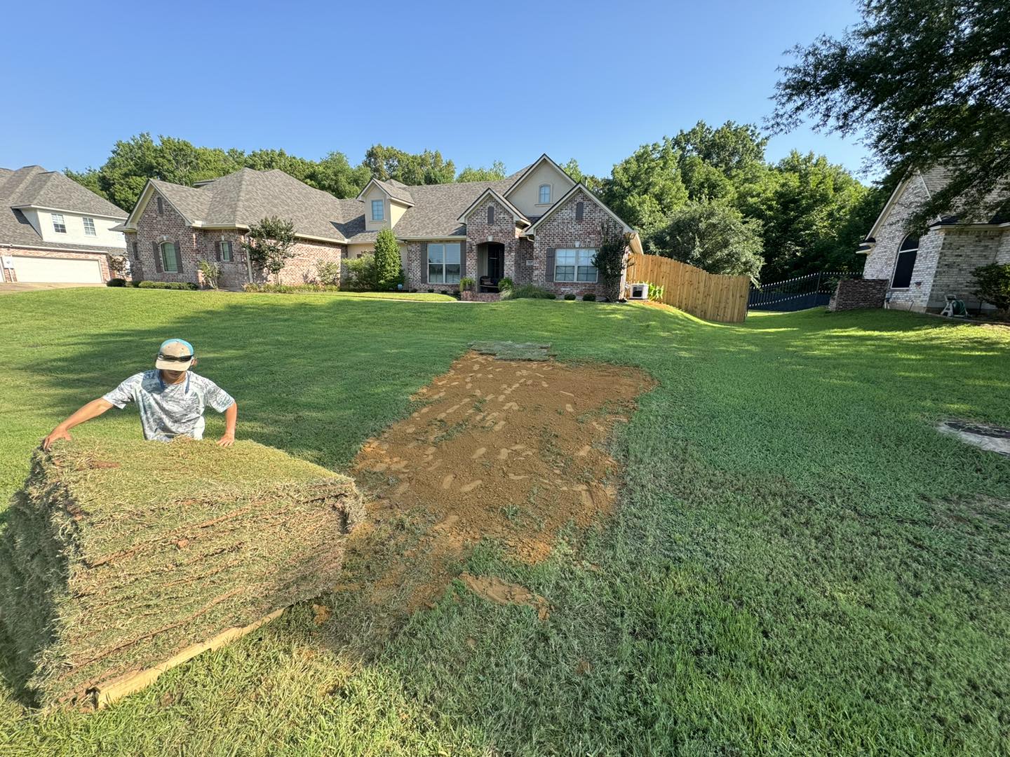 raised garden bed at shreveport home with new mulch and planted shrubs